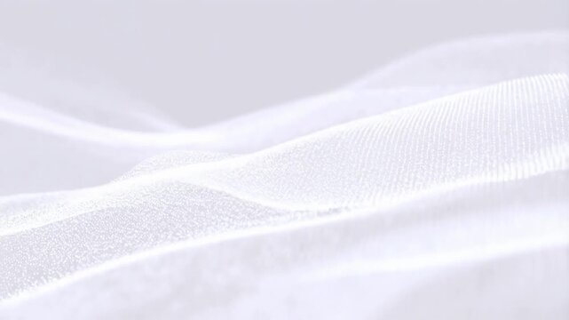 Close-up animation of white fabric gently waving with soft texture details and fine threads visible across the surface. Animated backdrop combines soft focus with visible depth.
