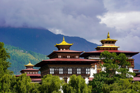 Thimphu Dzong, Tashichho Dzong, Traditional Bhutanese architecture with golden roof spires and lush greenery, Thimphu, Bhutan, SEP 2026