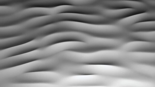 Grayscale soft gradient waves undulate smoothly across a dark gray background with flowing horizontal motion. Flowing motion creates soft blur and visible depth.