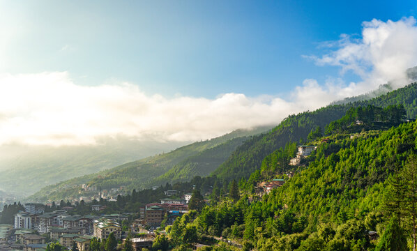 City view of Thimphu, Bhutan, Viewpoint on SEP 2026, Scenic View of Mountain Town with Green Forest and Blue Sky Clouds, sustainability, zero carbon, negative carbon