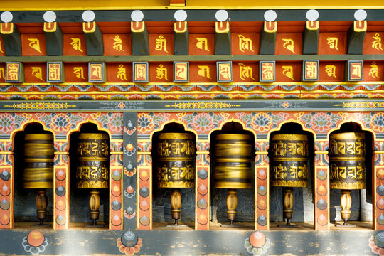 Changangkha Lhakhang, Traditional golden prayer wheel architecture in vibrant temple with intricate design