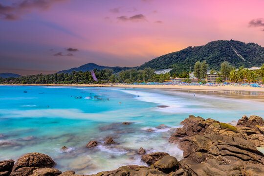 Long Exposure Seascape of Kata Beach with Rocky Shoreline and Tropical Forest, Phuket, Thailand