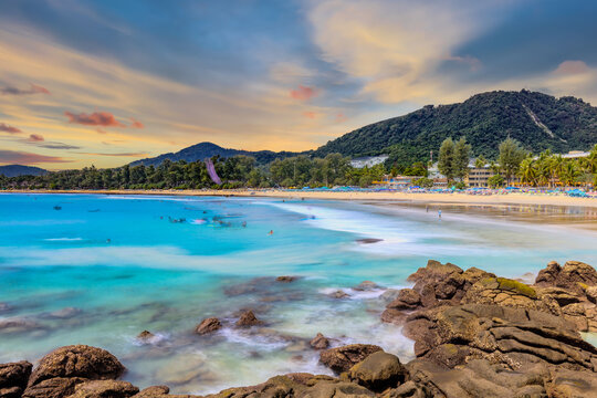 Long Exposure Seascape of Kata Beach with Rocky Shoreline and Tropical Forest, Phuket, Thailand
