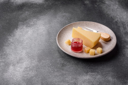 Hard aged Parmesan cheese in blocks and cubes for home cooking. Parmesan cheese