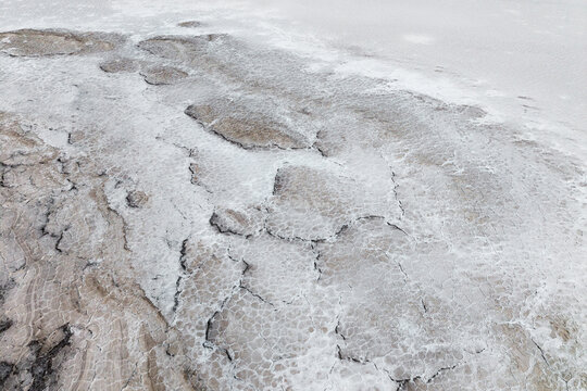 Cracked saline texture on a natural salt flat surface