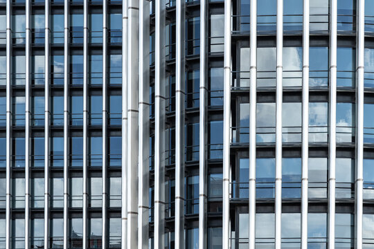 Modern office building facade with glass windows and columns
