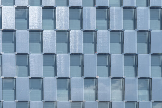 Modern office building facade with repeating glass windows