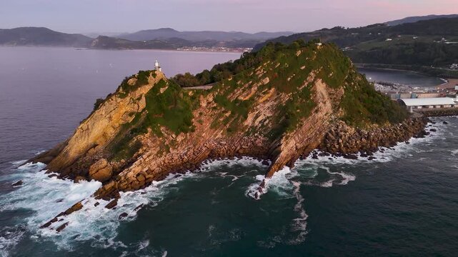Scenic Getaria lighthouse on San Anton mountain in Spain
