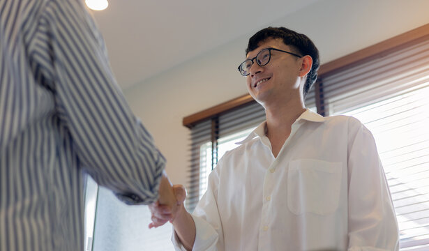 close up investor businessman handshake with partner vendor,collaboration of two ceo leader hand shake for agreement or deal financial cooperative concept