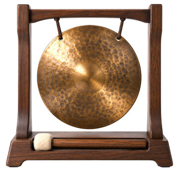 Traditional brass gong with wooden stand and mallet isolated
