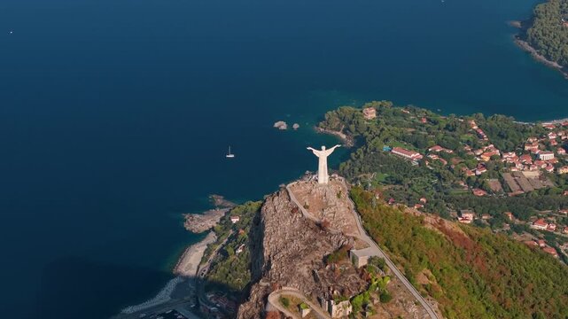 Cristo Redentore Maratea Basilicata Italy 70mm Aerial Drone View Statue of Christ Redeemer Coastal Village Tyrrhenian Sea High Angle Travel Video 4K UHD