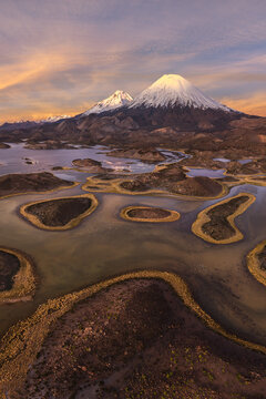 Parinacota Volcano above Lauca National Park wetlands at sunset