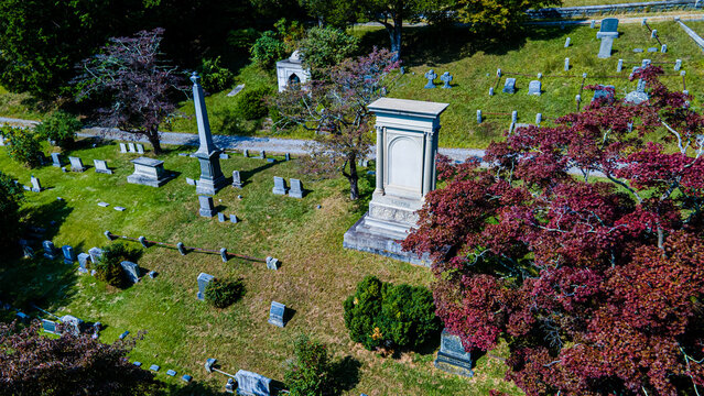 Sleepy Hollow, United States - 22 September 2020: Aerial view of Sleepy Hollow Cemetery featuring historic gravestones, stone monuments, and lush trees.