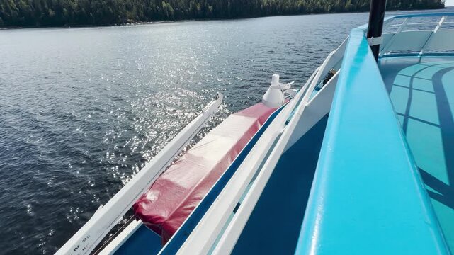 A cruise ship sails across Valaam, Lake Ladoga. This scenic view inspires a calm, happy feeling of peaceful journey and joyful adventure.