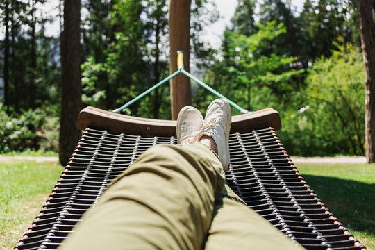 Relax in a wooden hammock at a family park