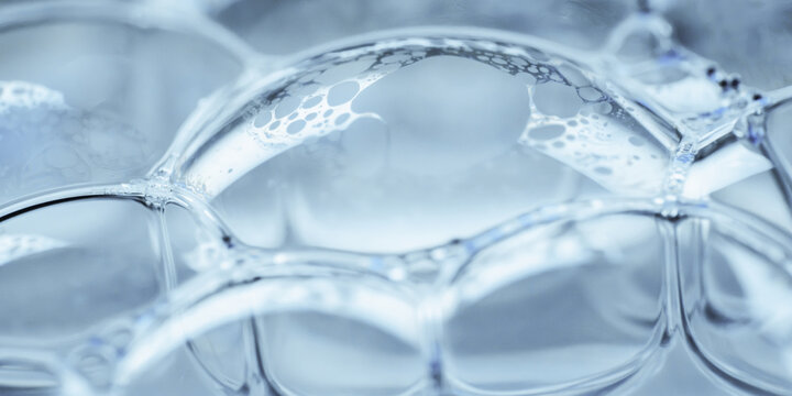 Macro view of translucent soap bubble with delicate foam texture