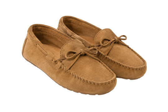 Pair of light brown suede moccasin shoes with decorative laces and stitching, presented on a clean white background