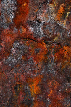 Rusty oxide texture on weathered rock surface background