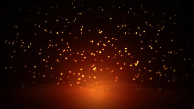 Golden glowing particles rising above bright light on black