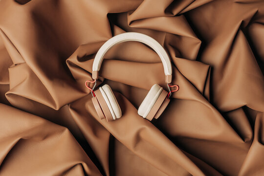 Brown headphones on Mocha Mousse leather fabric