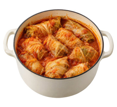 Delicious homemade stuffed cabbage rolls simmering in a rich tomato sauce inside a white enamel cast iron pot, isolated on a white background