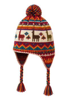 Colorful knitted Peruvian chullo hat with a pompom and braided ear flaps, featuring llama patterns on a white background