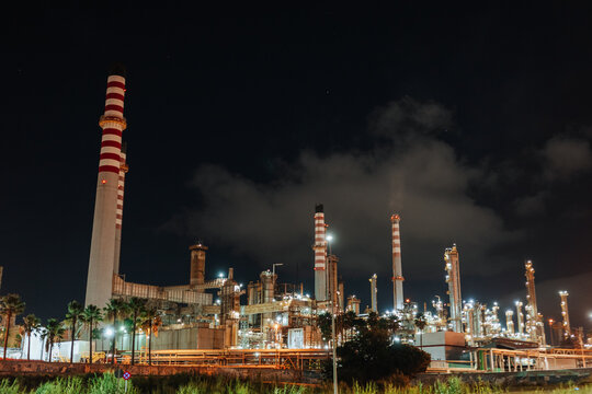 Oil refinery industrial complex illuminated at night in Portugal