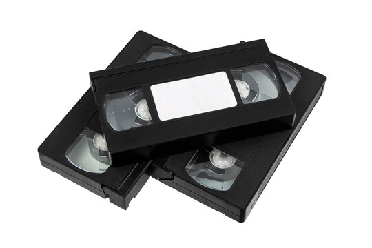 Stack of black retro VHS videotapes with blank label isolated on white back