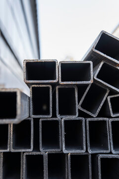 Stacked square steel profile pipes background
