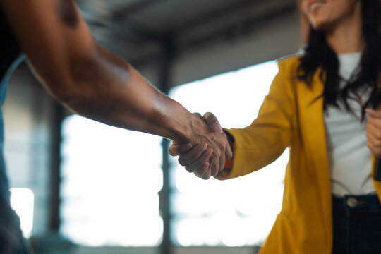 Business people shaking hands confirming partnership agreement