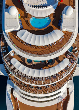 Nassau, The Bahamas - 27 December 2025: Aerial view of Nassau Cruise Port, showing the upper decks of a luxury cruise ship with swimming pools, sun loungers, and modern architectural curves.