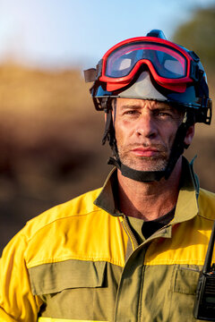 
Wildland firefighter portrait with helmet and protective goggles