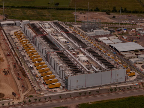 Parque Industrial PyME, Mexico - 18 September 2026: Aerial view of ODATA QR03 data center facility featuring rows of yellow power generators and industrial infrastructure.