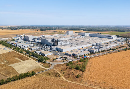 Racalmas, Hungary - 26 August 2026: Aerial view of Hankook Tyre manufacturing plant with industrial buildings, warehouses, trucks and surrounding fields in Fejer County.