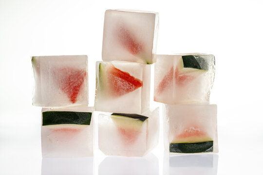 Watermelon ice cubes stacked for refreshing summer drinks