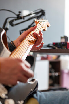 Musician play electric guitar in home recording studio