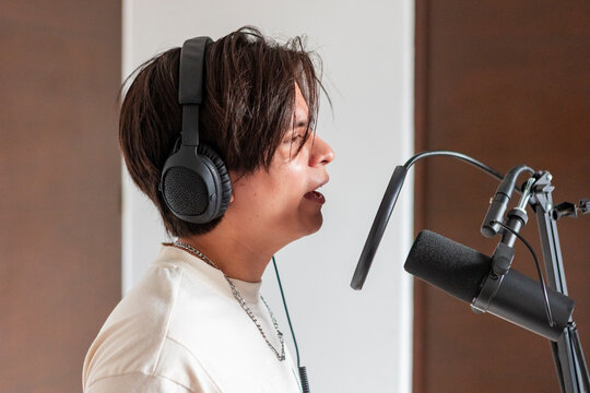 Music composer record vocal performance with studio microphone