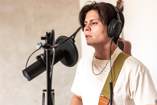 Music composer record vocal performance with studio microphone