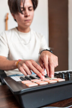 Music compositor creating electronic beats on pad controller