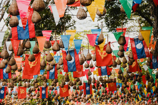 Colorful Lao flags and lanterns at Wat Phu Champasak