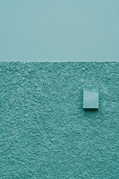 Yellow Turret Against a Mint-Green Wall in Akureyri