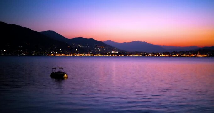A boat at dawn on lake Maggiore.