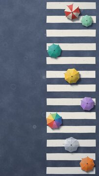 Colorful paper umbrellas crossing a zebra crosswalk in the rain, top view papercraft with raindrop ripples, vertical video background, seamless loop
