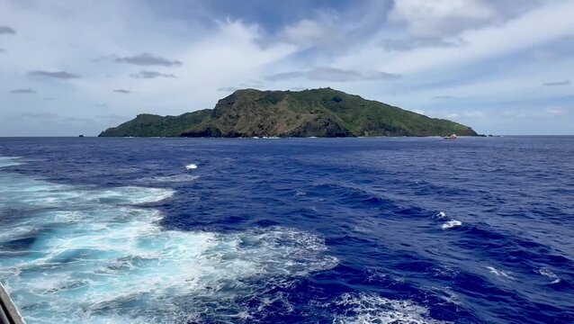 Pitcairn Island in the South Pacific Ocean, remote tropical island viewed from a cruise ship