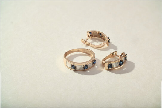 Elegant jewelry set. Jewellery set with gemstones. Product still life concept. Ring, necklace and earrings.