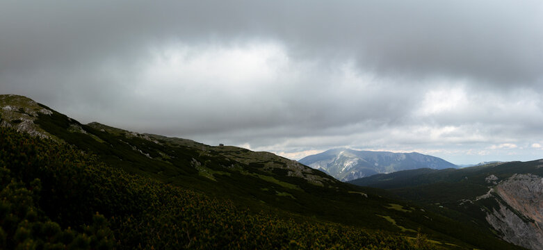 Dramatic Dark Storm Clouds over Remote Alpine Mountain Landscape with Rocky Ridges and Dwarf Pine in Rax Alps Austria