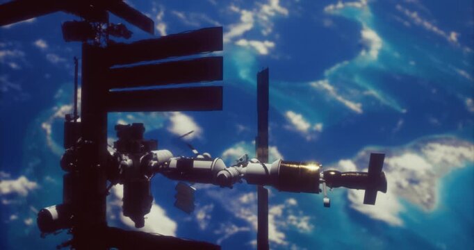 The image shows a large space station floating in low Earth orbit, surrounded by vibrant blue oceans and clouds. This moment captures the beauty of our planet from space.