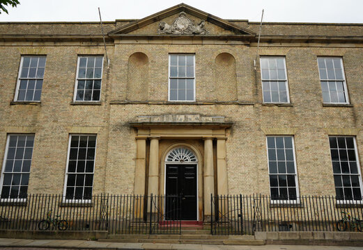 Georgian facade with royal arms pediment and railings in Lincoln