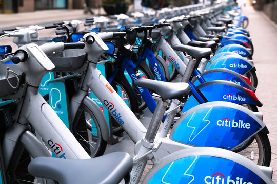New York, USA - 25 December 2025. Rows of Citi Bike rental bicycles and electric bikes parked at a docking station in New York City, urban shared mobility and public transportation.