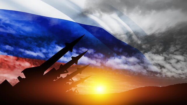 The missiles are aimed at the sky at sunset with Russian flag. Nuclear bomb, chemical weapons, missile defense, a system of salvo fire.